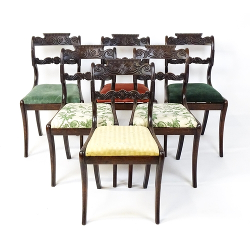 1502 - A set of six early / mid 19thC Irish dining chairs with floral and scroll carved mid and top rails a... 