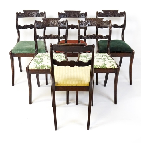 1502 - A set of six early / mid 19thC Irish dining chairs with floral and scroll carved mid and top rails a... 