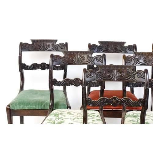 1502 - A set of six early / mid 19thC Irish dining chairs with floral and scroll carved mid and top rails a... 