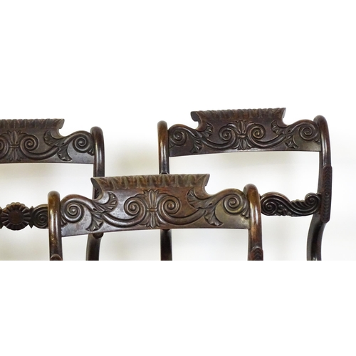 1502 - A set of six early / mid 19thC Irish dining chairs with floral and scroll carved mid and top rails a... 