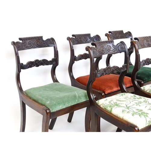 1502 - A set of six early / mid 19thC Irish dining chairs with floral and scroll carved mid and top rails a... 