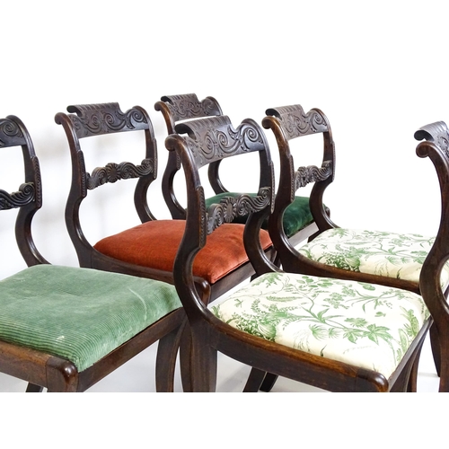 1502 - A set of six early / mid 19thC Irish dining chairs with floral and scroll carved mid and top rails a... 