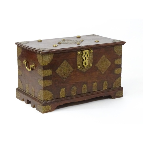 1503 - A 19thC marriage chest / dowry chest with brass mounts and brackets decorating the exterior alongsid... 