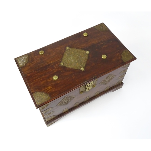 1503 - A 19thC marriage chest / dowry chest with brass mounts and brackets decorating the exterior alongsid... 