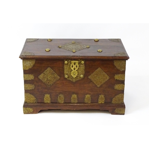 1503 - A 19thC marriage chest / dowry chest with brass mounts and brackets decorating the exterior alongsid... 