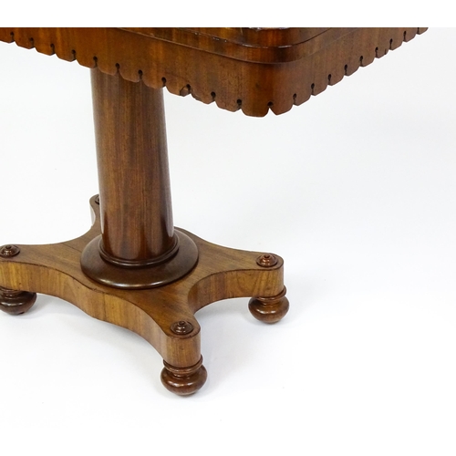 1504 - A 19thC mahogany tea table / card table with a hinged, revolving top above a turned pedestal and app... 