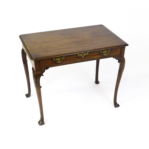 1506 - A George III mahogany side table with a moulded top above a single long frieze rawer with brass hand... 