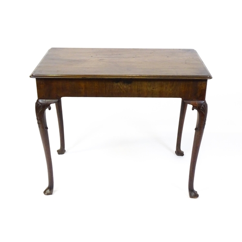 1506 - A George III mahogany side table with a moulded top above a single long frieze rawer with brass hand... 