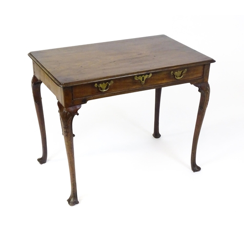 1506 - A George III mahogany side table with a moulded top above a single long frieze rawer with brass hand... 