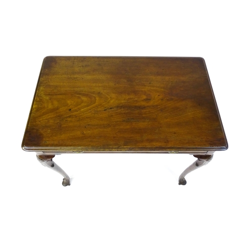 1506 - A George III mahogany side table with a moulded top above a single long frieze rawer with brass hand... 