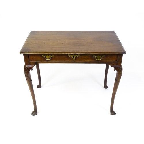 1506 - A George III mahogany side table with a moulded top above a single long frieze rawer with brass hand... 