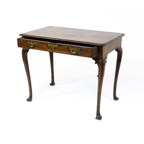 1506 - A George III mahogany side table with a moulded top above a single long frieze rawer with brass hand... 