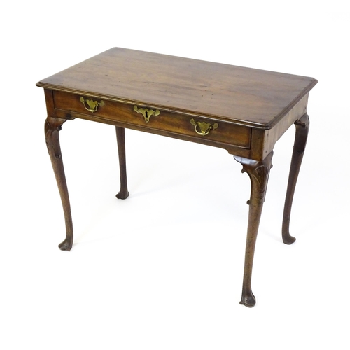 1506 - A George III mahogany side table with a moulded top above a single long frieze rawer with brass hand... 