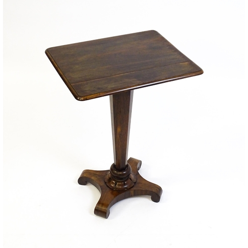 1508 - A 19thC rosewood occasional table with a canted pedestal above a carved plinth and quatre form base ... 