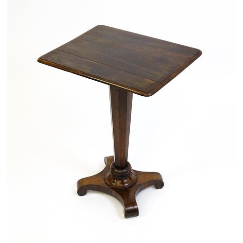 1508 - A 19thC rosewood occasional table with a canted pedestal above a carved plinth and quatre form base ... 