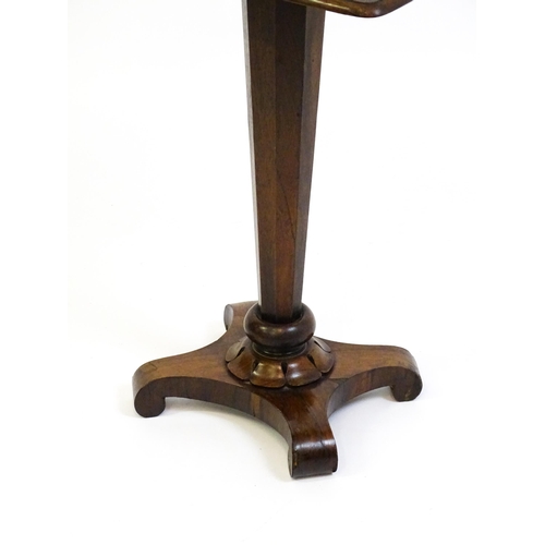 1508 - A 19thC rosewood occasional table with a canted pedestal above a carved plinth and quatre form base ... 