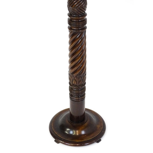 1509 - A Victorian mahogany torchiere / jardinière stand with a twist turned pedestal with carved decoratio... 