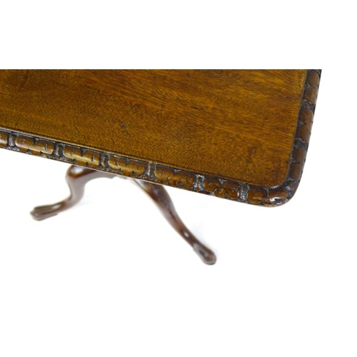 1514 - A late 18thC / early 19thC mahogany occasional table with a rectangular top and carved edge above a ... 