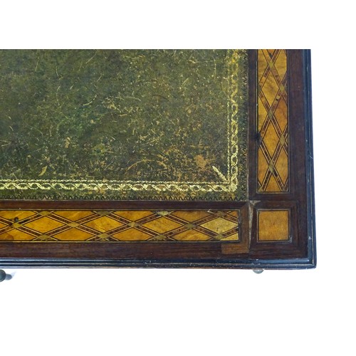 1513 - A 19thC side table with a satinwood inlaid top enclosing a gold tooled green leather top above a sin... 