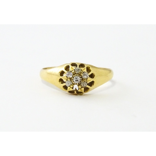 745A - An 18ct gold ring set with 6 diamonds. Ring size approx L