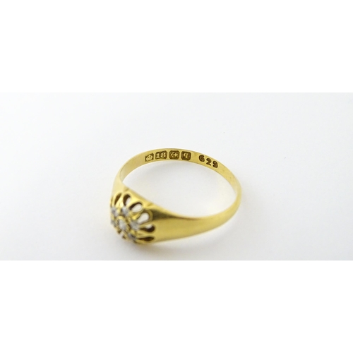 745A - An 18ct gold ring set with 6 diamonds. Ring size approx L