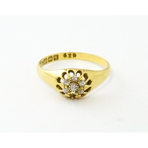 745A - An 18ct gold ring set with 6 diamonds. Ring size approx L