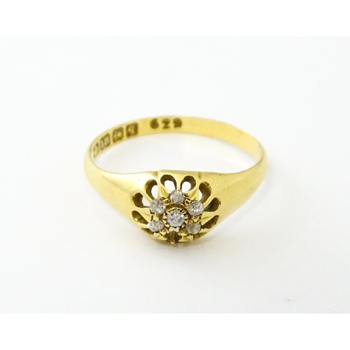 745A - An 18ct gold ring set with 6 diamonds. Ring size approx L