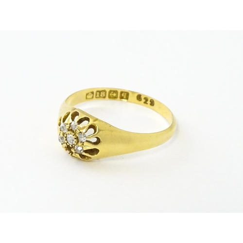 745A - An 18ct gold ring set with 6 diamonds. Ring size approx L