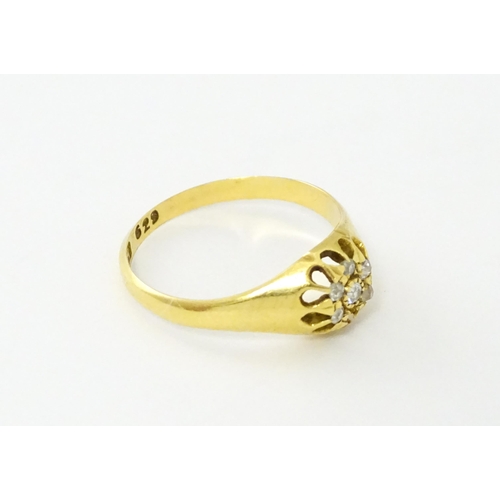 745A - An 18ct gold ring set with 6 diamonds. Ring size approx L