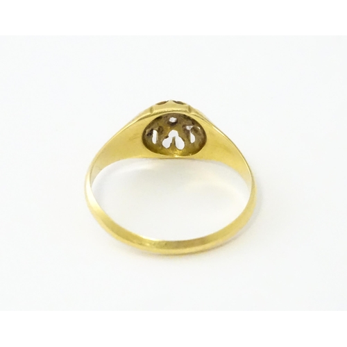 745A - An 18ct gold ring set with 6 diamonds. Ring size approx L