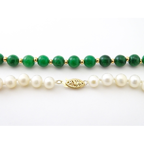 727 - A necklace of jade beads and pearls with 14ct gold clasp. Approx 18