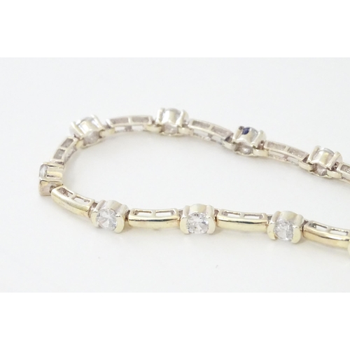 734 - A .925 Silver bracelet set with cubic zirconia. Approx 7 1/2