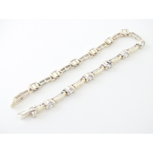 734 - A .925 Silver bracelet set with cubic zirconia. Approx 7 1/2