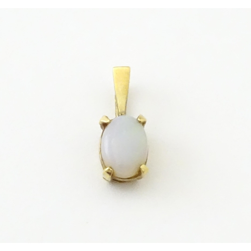 742 - A 9ct gold pendant set with opal together with a pendant set with tigers eye cabochon. Approx 1 1/2