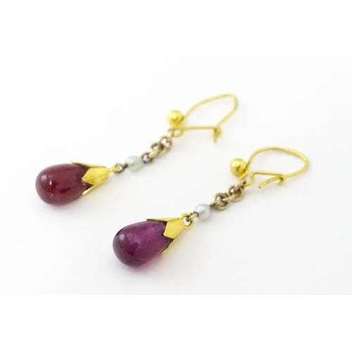 746 - A pair of 9ct gold drop earrings set with seed pearls and sapphire drops. 1 1/4