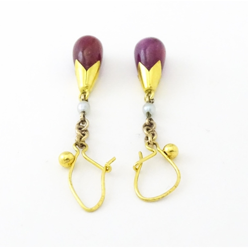 746 - A pair of 9ct gold drop earrings set with seed pearls and sapphire drops. 1 1/4