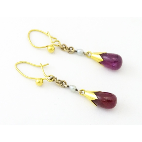 746 - A pair of 9ct gold drop earrings set with seed pearls and sapphire drops. 1 1/4