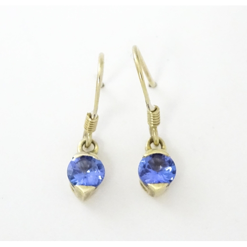 748 - A pair of silver gilt drop earrings set with tanzanites. Approx. 1/2