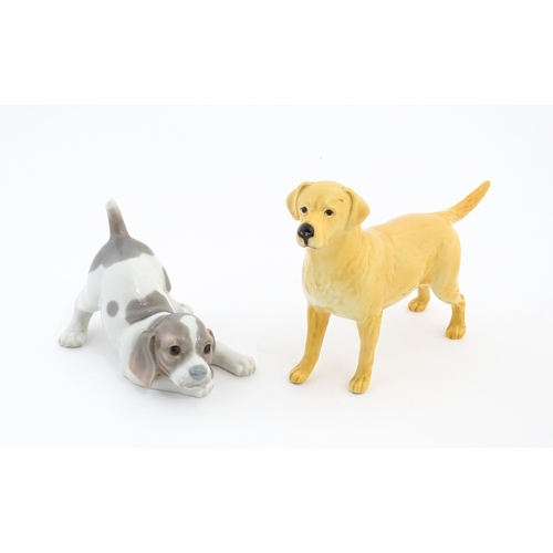 125 - A Beswick model of a Golden Labrador. Together with a Lladro playful puppy. Beswick dog approx. 5 1/... 