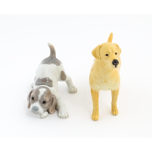 125 - A Beswick model of a Golden Labrador. Together with a Lladro playful puppy. Beswick dog approx. 5 1/... 