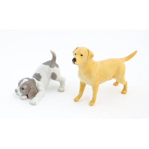 125 - A Beswick model of a Golden Labrador. Together with a Lladro playful puppy. Beswick dog approx. 5 1/... 