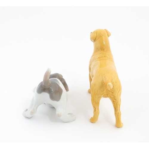 125 - A Beswick model of a Golden Labrador. Together with a Lladro playful puppy. Beswick dog approx. 5 1/... 