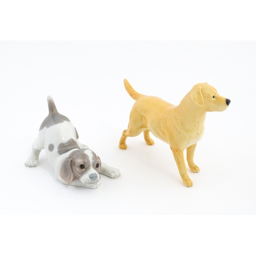 125 - A Beswick model of a Golden Labrador. Together with a Lladro playful puppy. Beswick dog approx. 5 1/... 