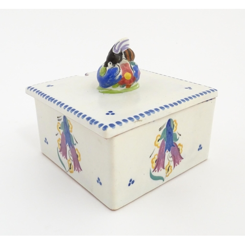 139 - A Poole Pottery honeycomb box and cover with bee finial. Marked under. Approx. 4 1/2