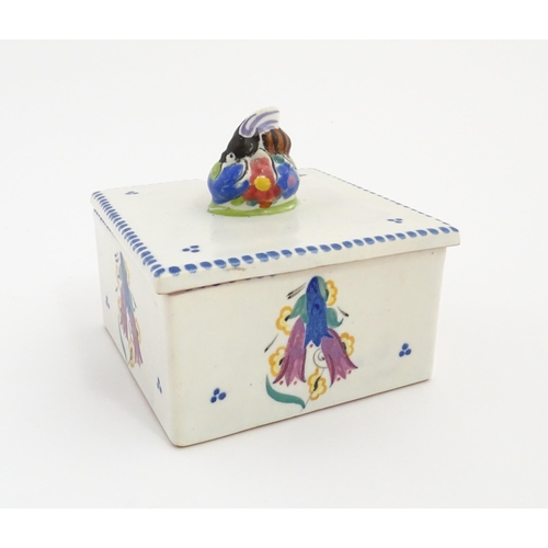 139 - A Poole Pottery honeycomb box and cover with bee finial. Marked under. Approx. 4 1/2