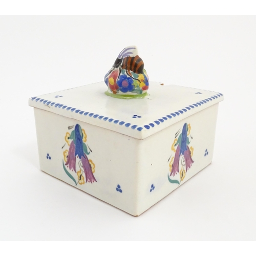 139 - A Poole Pottery honeycomb box and cover with bee finial. Marked under. Approx. 4 1/2