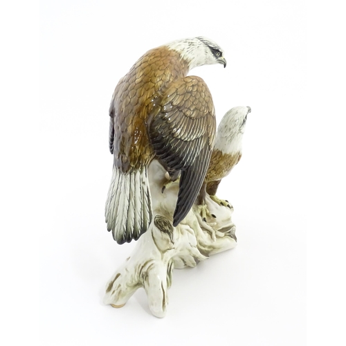 145 - A Karl Ens bird of prey group modelled as two eagles perched on a branch. Marked under with no. 7726... 