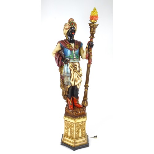 1419 - A mid 20thC blackamoor lamp, the lamp having a polychrome figural top grasping a torchiere, the figu... 