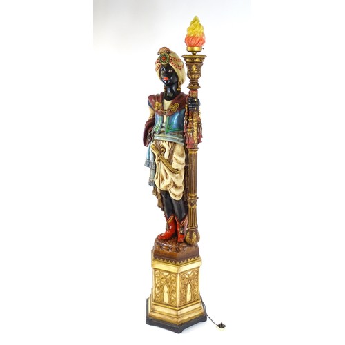 1419 - A mid 20thC blackamoor lamp, the lamp having a polychrome figural top grasping a torchiere, the figu... 