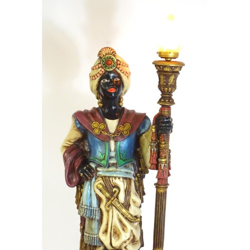 1419 - A mid 20thC blackamoor lamp, the lamp having a polychrome figural top grasping a torchiere, the figu... 